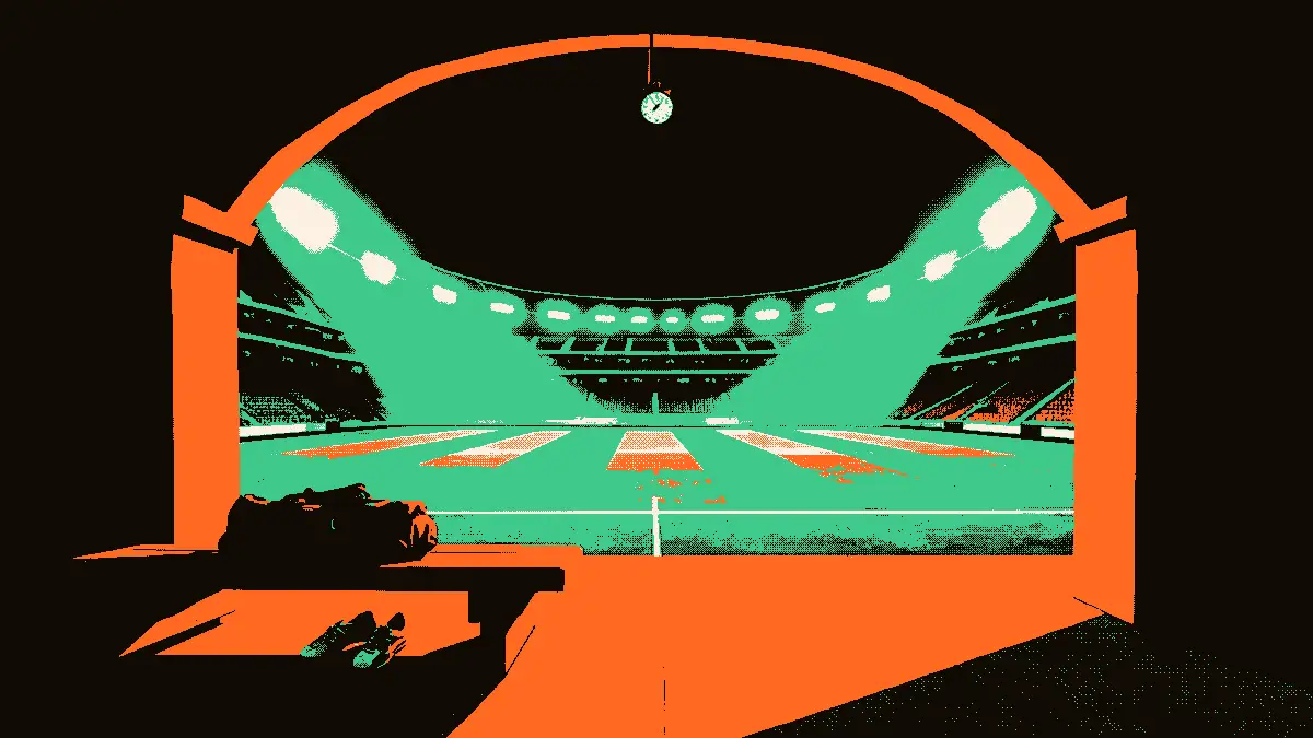 Vue d'un tunnel de stade de football éclairé par des projecteurs, donnant sur un terrain vide, avec un sac de sport et des crampons posés sur un banc au premier plan et un chronomètre suspendu.
