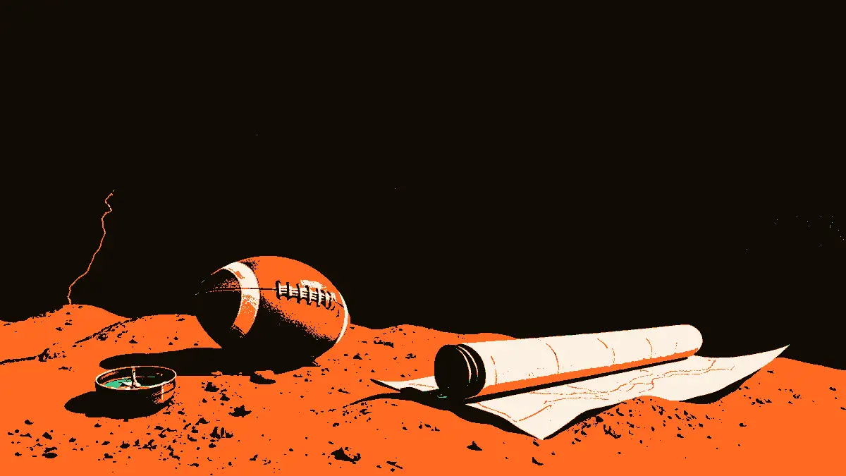 Un ballon de football en cuir posé sur du sable rouge à côté d'une boussole ancienne et d'une carte enroulée, sur fond de flèches de pierre monumentales dans une brume légère.