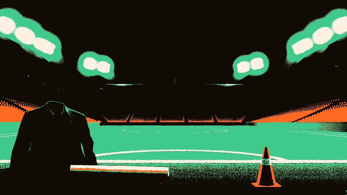 Stade de football vide illuminé par des projecteurs, un costume sombre et un parchemin roulé posés sur le bord du terrain près d'un cône d'entraînement.